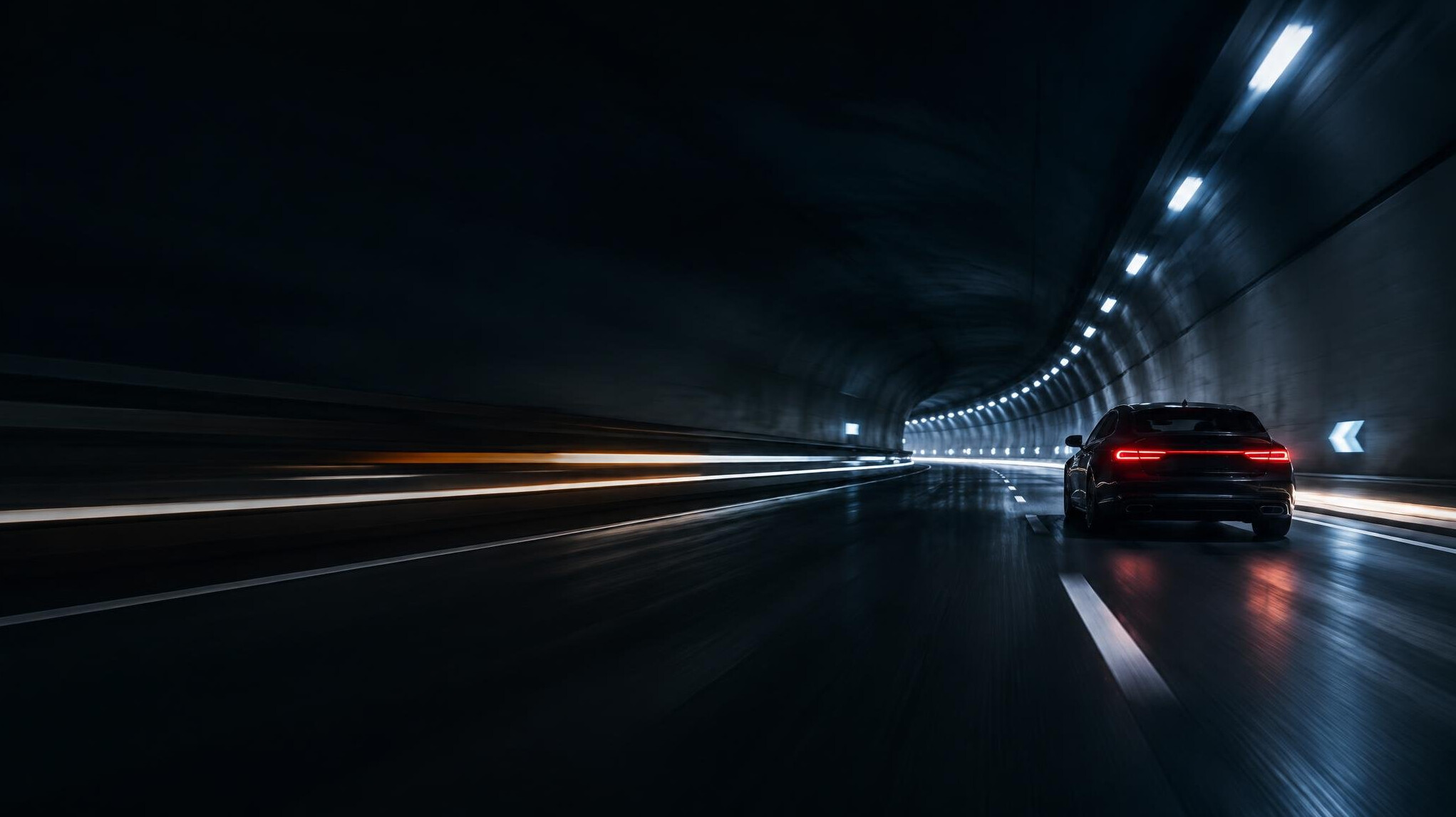 Car driving through a tunnel with light trails